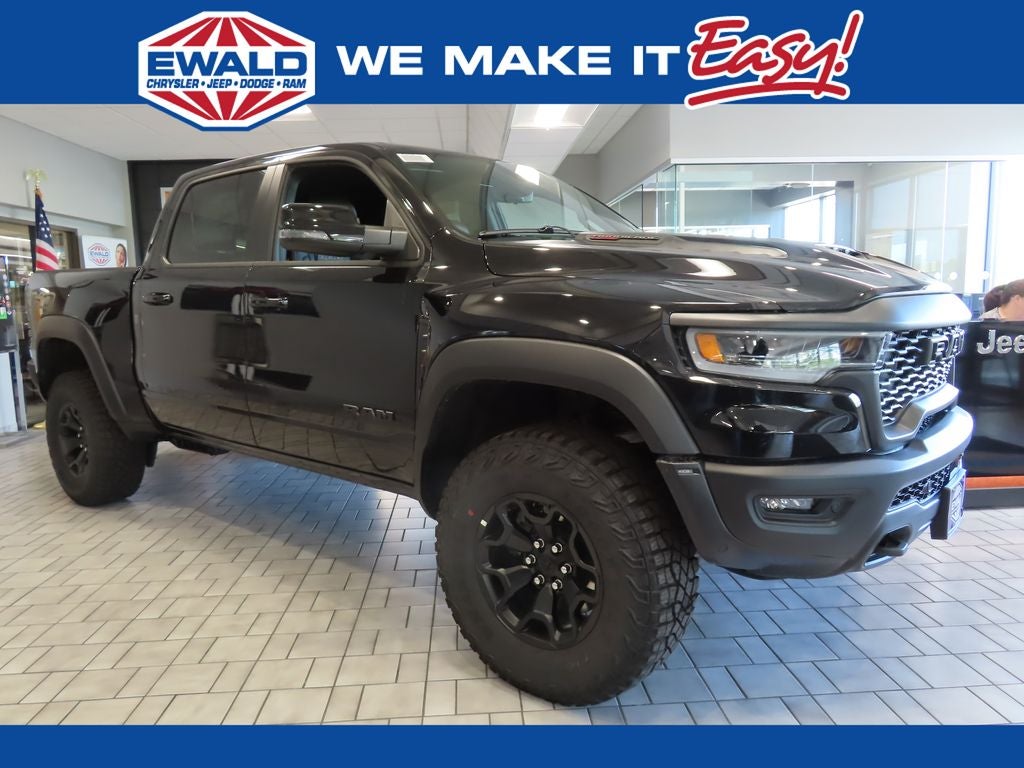 2026 RAM 1500 RAM 1500 RHO CREW CAB 4X4 5'7' BOX in Diamond Black Crystal Pearl-Coat Exterior Paint — front three-quarter view