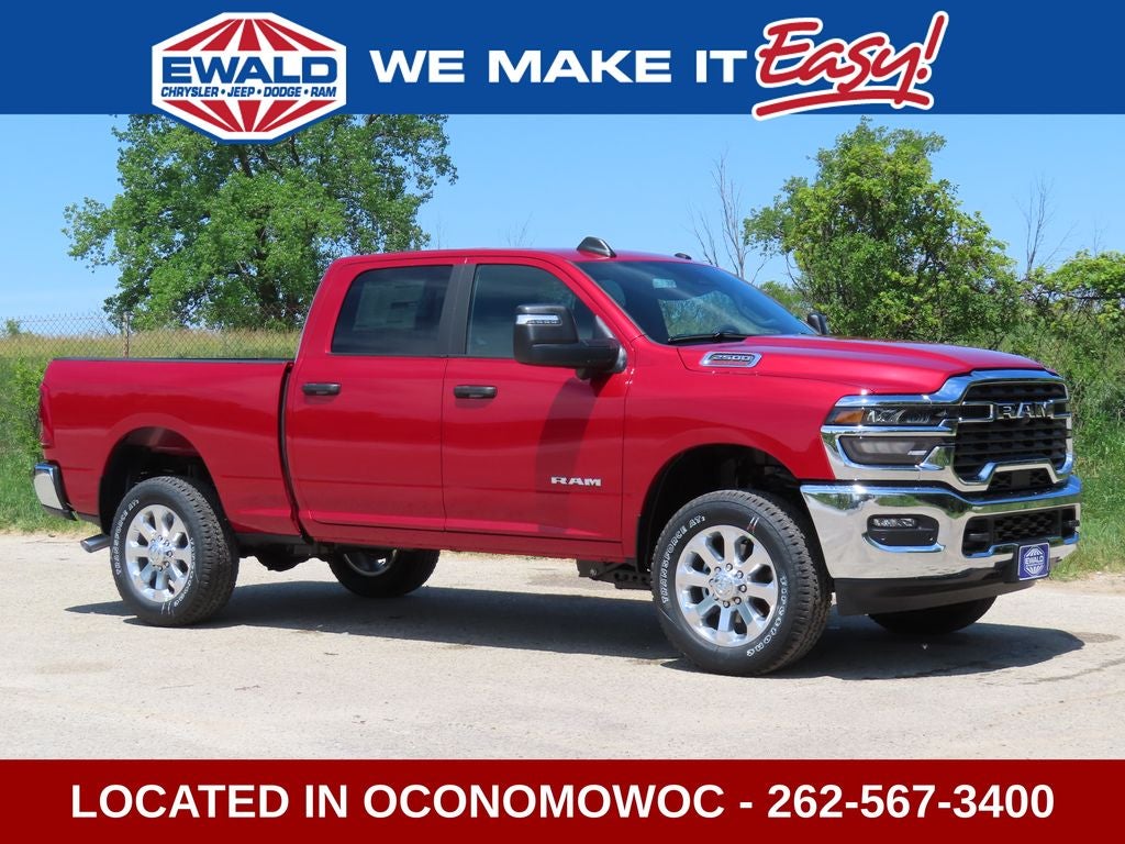 2026 RAM 2500 RAM 2500 BIG HORN CREW CAB 4X4 6'4' BOX in Molten Red Pearl-Coat Exterior Paint — front three-quarter view