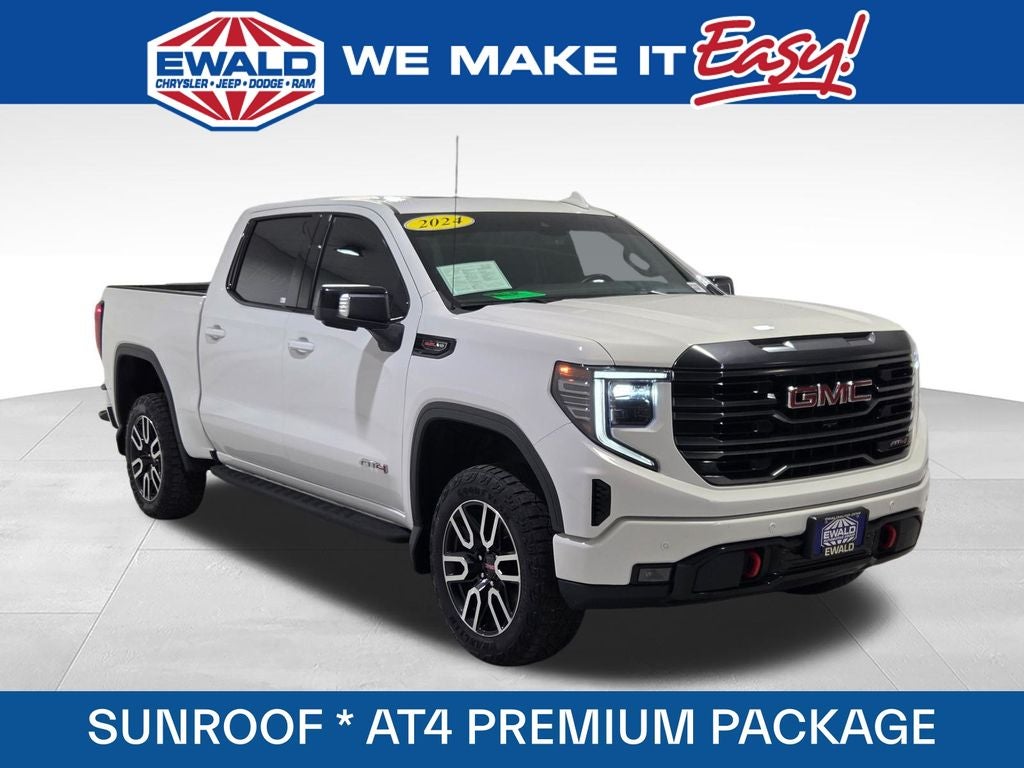 2024 GMC Sierra 1500 AT4 in Summit White — front three-quarter view